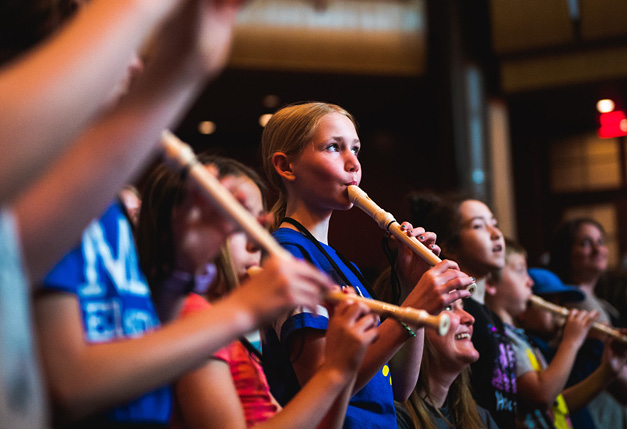 Elementary age students play recorders as part of Link Up concert