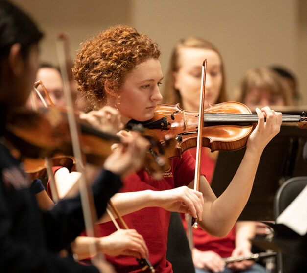 Close up of musician during Youth Orchestra alumni concert