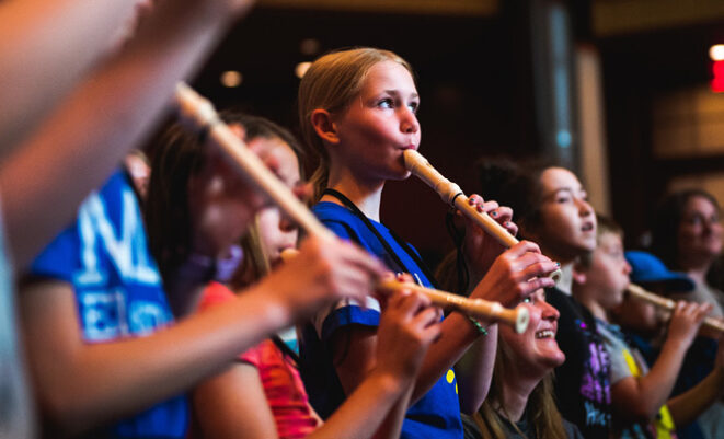 Elementary age students play recorders as part of Link Up concert