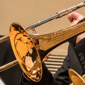 Close up of a trombone being used by a trombonist