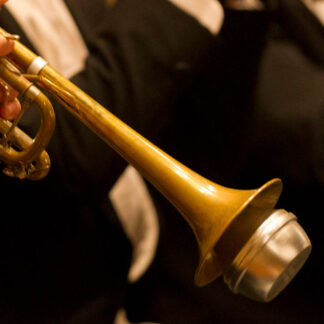 Close up of a trumpet being played by a trumpeter