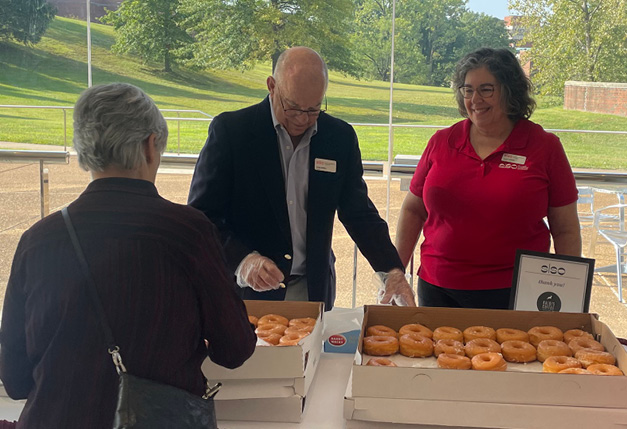 SVA members handing out donuts as part of volunteer duty at a Friday morning Coffee Concert