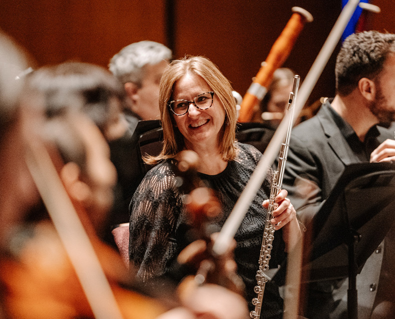 Close up of SLSO flute player Jennifer Nitchman talking on stage