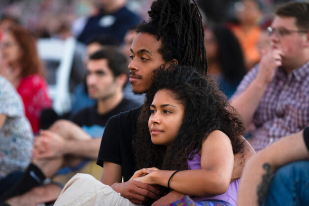 Patrons sitting and watching performance at Forest Park Concert